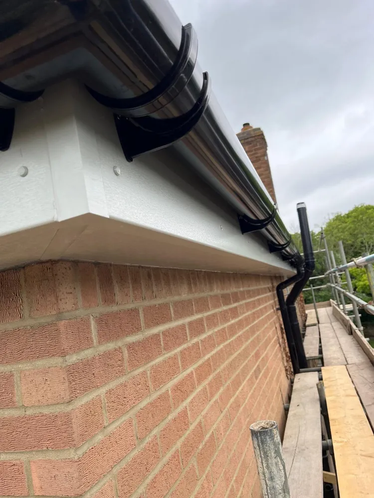Fascias Soffits And Black Half Round Guttering Down Pipe